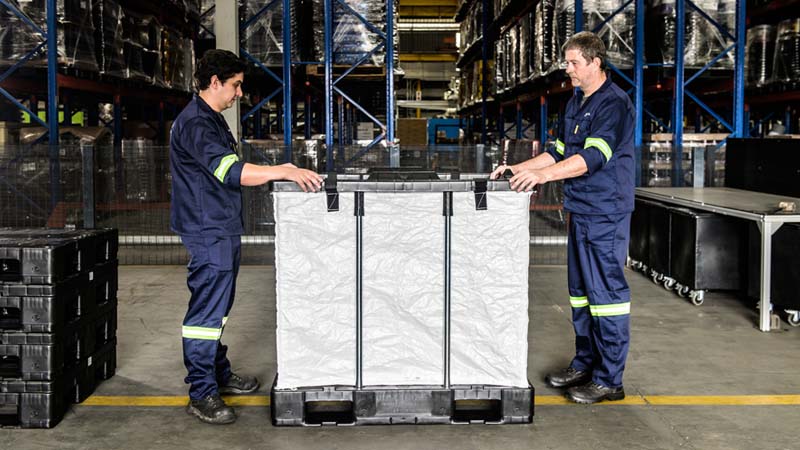Two workers assemble an ALPAL
